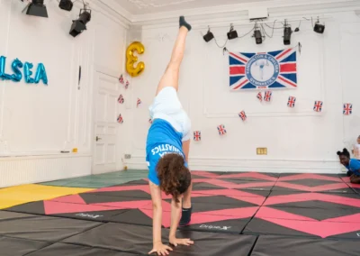 Young gymnast performing cartwheel at KCGA Annual Performance More House School Knightsbridge