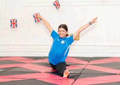 Young gymnast performing split pose at KCGA Annual Performance Knightsbridge London