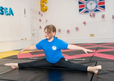 Young gymnast performing straddle splits at More House School Knightsbridge London SW1X