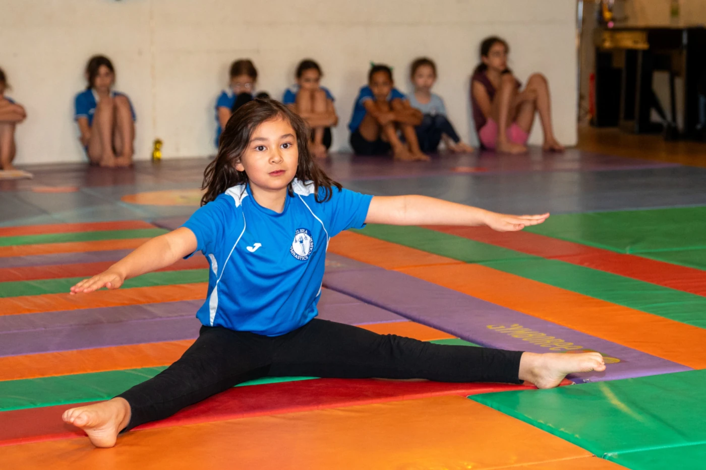 Leonie demonstrating flexibility with pointed toes during KCGA’s Annual Gymnastics Performance in London