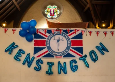 Kensington & Chelsea Gymnastics Academy banner at KCGA Annual Performance 2025 in London