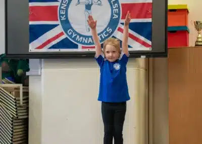 Young girl standing in the ready position on the air track during children’s gymnastics in Chelsea