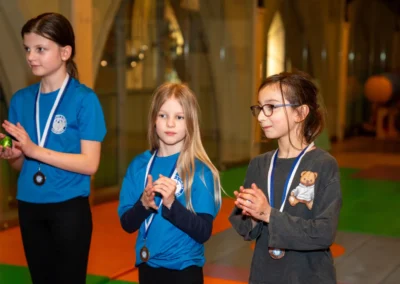 Female gymnasts wearing medals after an Easter gymnastics session in Kensington London