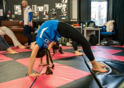 Child holding a bridge position during gymnastics training in Knightsbridge London