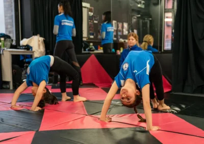 Children practising bridge exercises together during gymnastics classes in Knightsbridge London