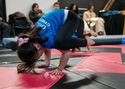 Child performing a crow pose balance exercise during gymnastics classes in Knightsbridge London