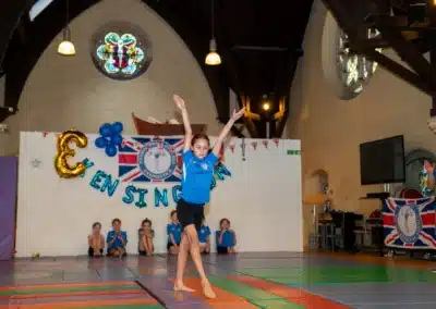 Young gymnast presenting a floor routine during KCGA Annual Performance 2025 in Kensington, London.