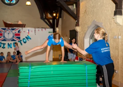 English gymnast performing a straddle over vault skill during KCGA Annual Performance 2025 in Kensington, London.
