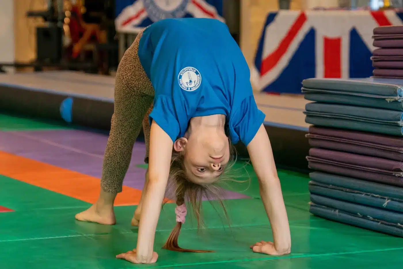 KCGA gymnast performing a bridge during Annual Performance 2026 at St Philip's Church