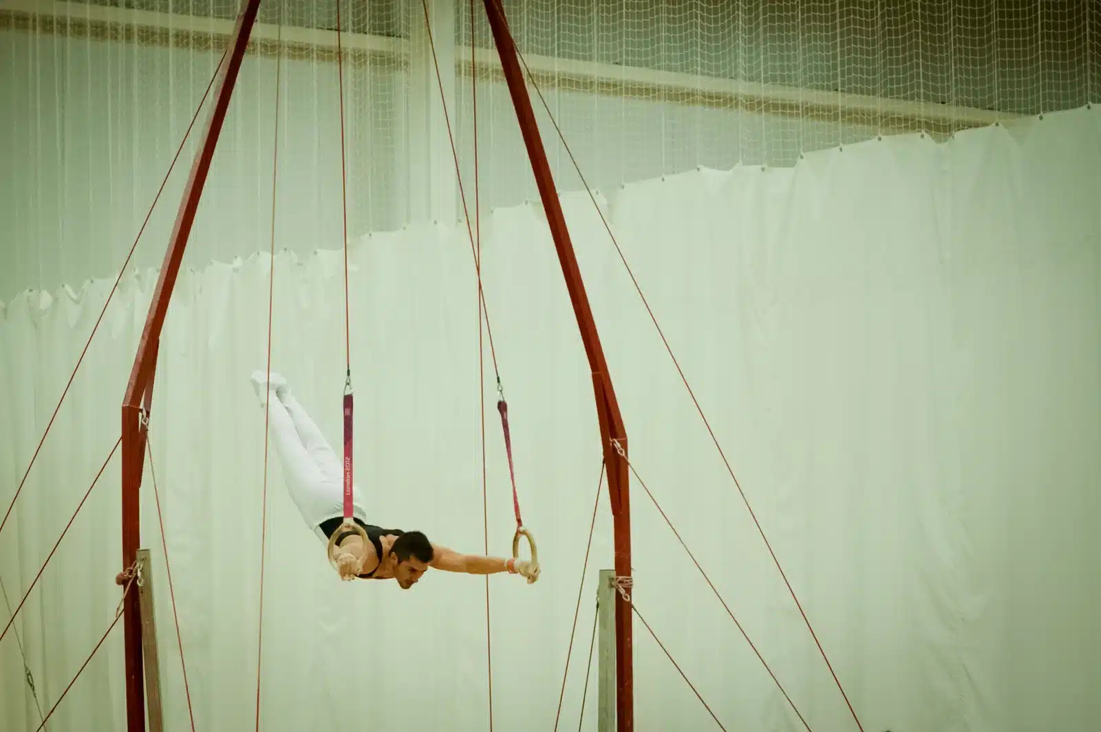 Dr Stefan Kolimechkov in a bail from handstand before a double tucked backward salto dismount at the 2015 London Gymnastics Regional Championships