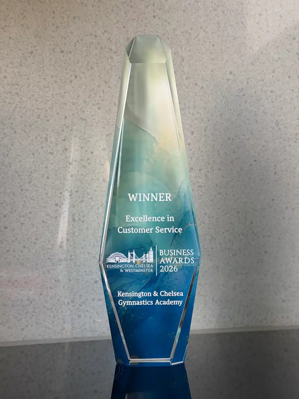 KCGA Excellence in Customer Service winner trophy from the 2026 Kensington, Chelsea and Westminster Business Awards