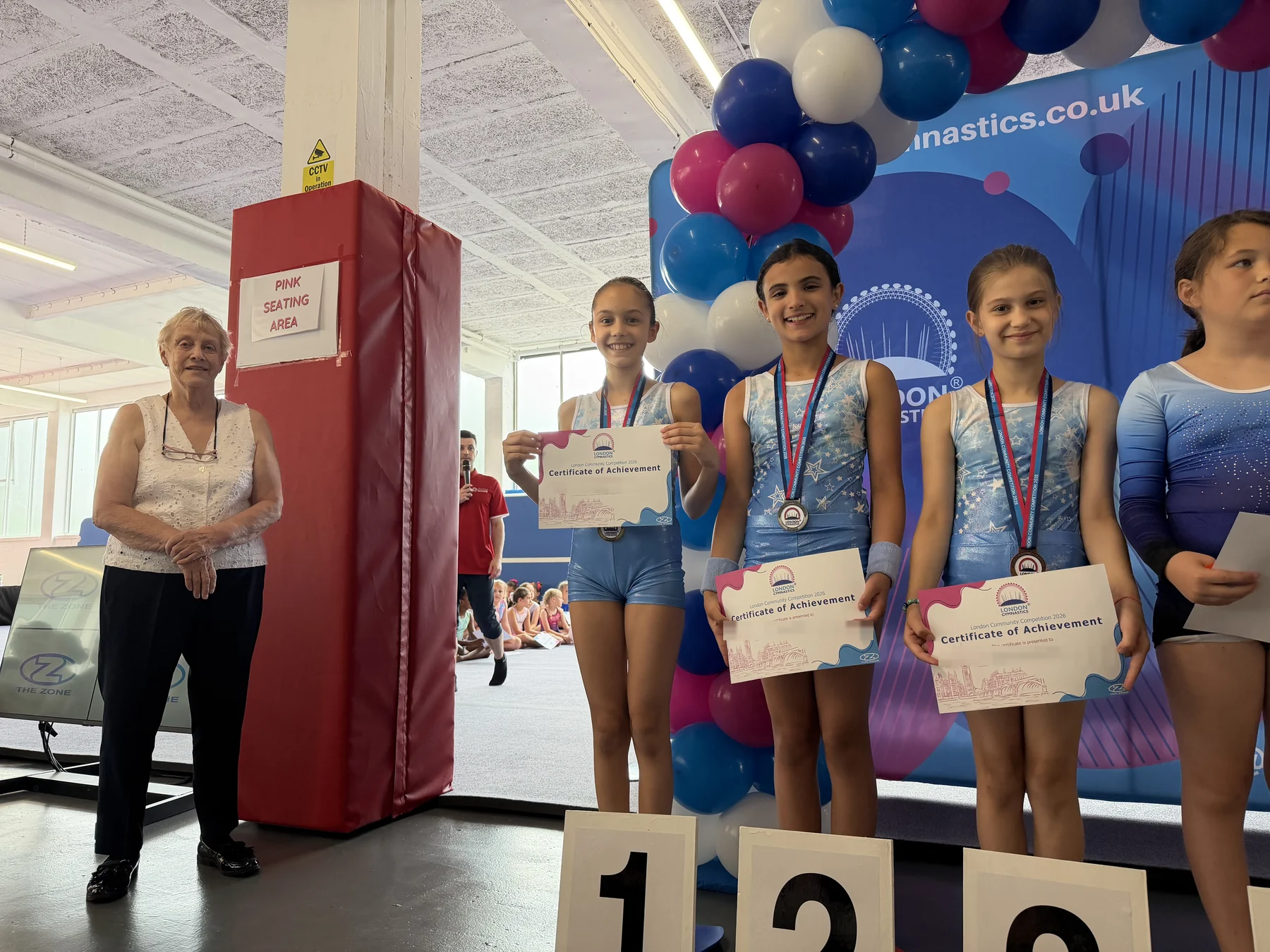 Sofia, Pearl and Sophie with their gold, silver and bronze medals at the 2026 London Community Competition