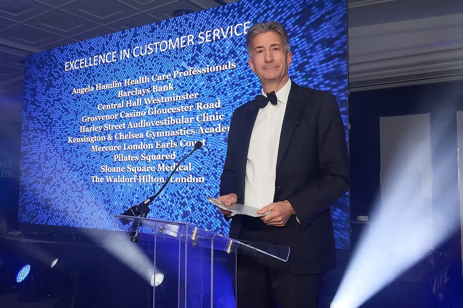 Mark Chick of Bishop and Sewell presenting the Excellence in Customer Service category at the 2026 Kensington, Chelsea and Westminster Business Awards