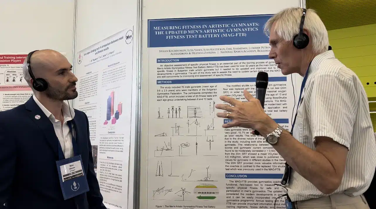 Professor Asgeir Mamen discussing Stefan Kolimechkov's poster at ECSS Seville 2022
