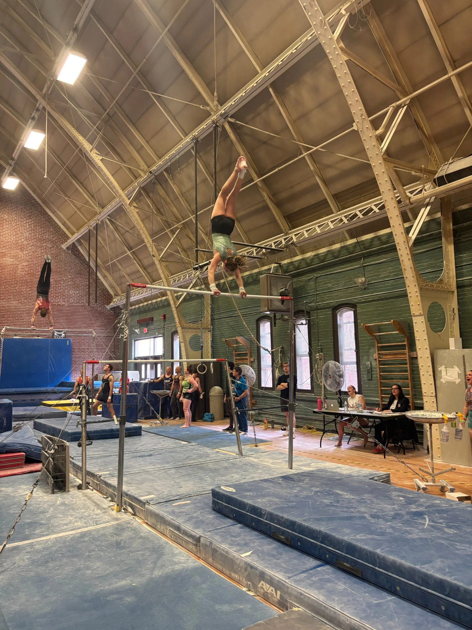 A gymnast performs on the uneven bars during the 2026 Masters Gymnastics World Cup at MIT in Cambridge, Massachusetts.