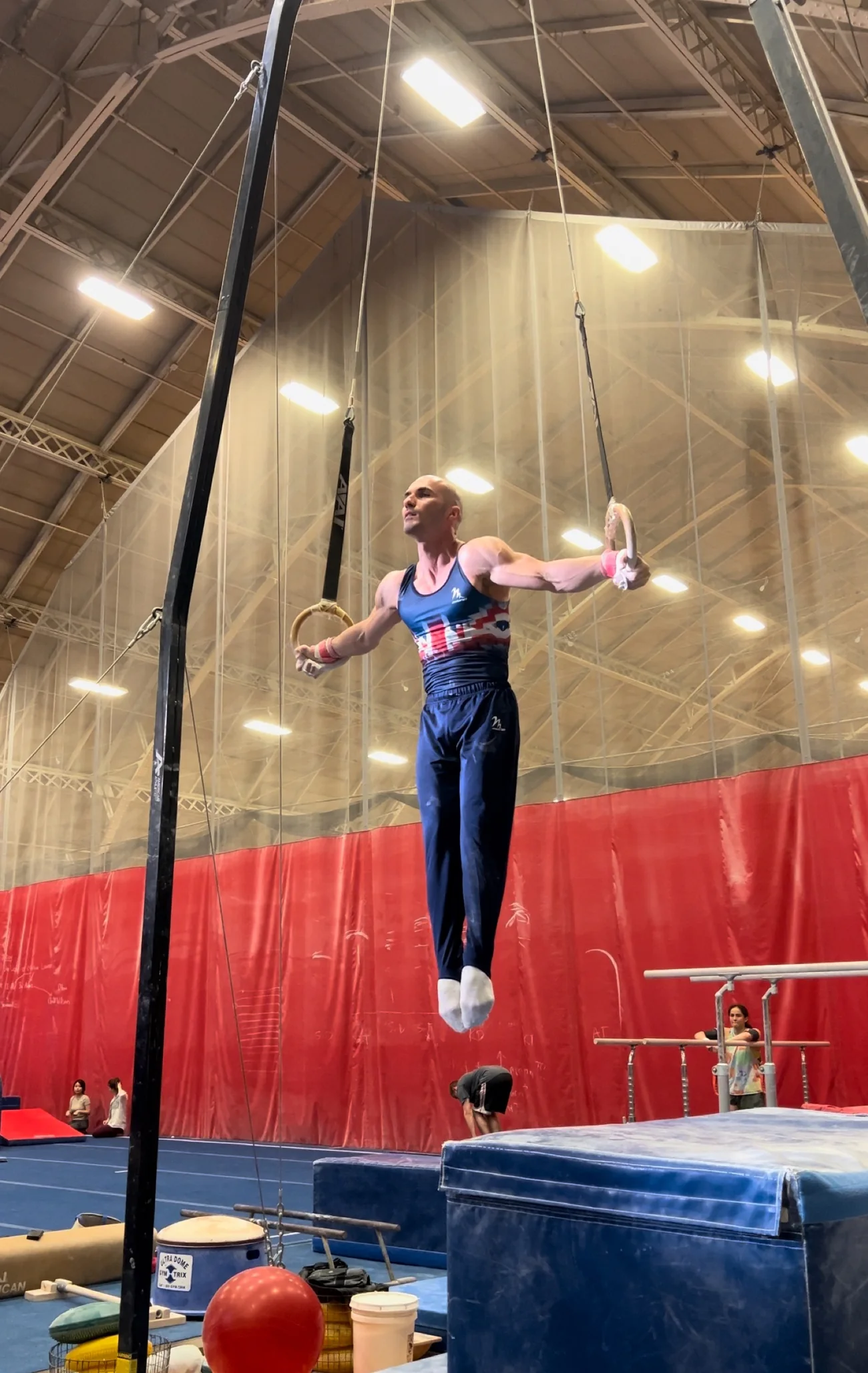 Dr Stefan Kolimechkov warming up on rings the day before the 2024 Cambridge Masters competition.