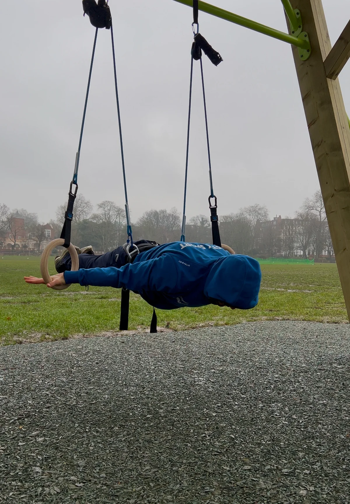 Stefan Kolimechkov practising an assisted Maltese on outdoor rings with the Gymnastics Forza Ring System in winter.